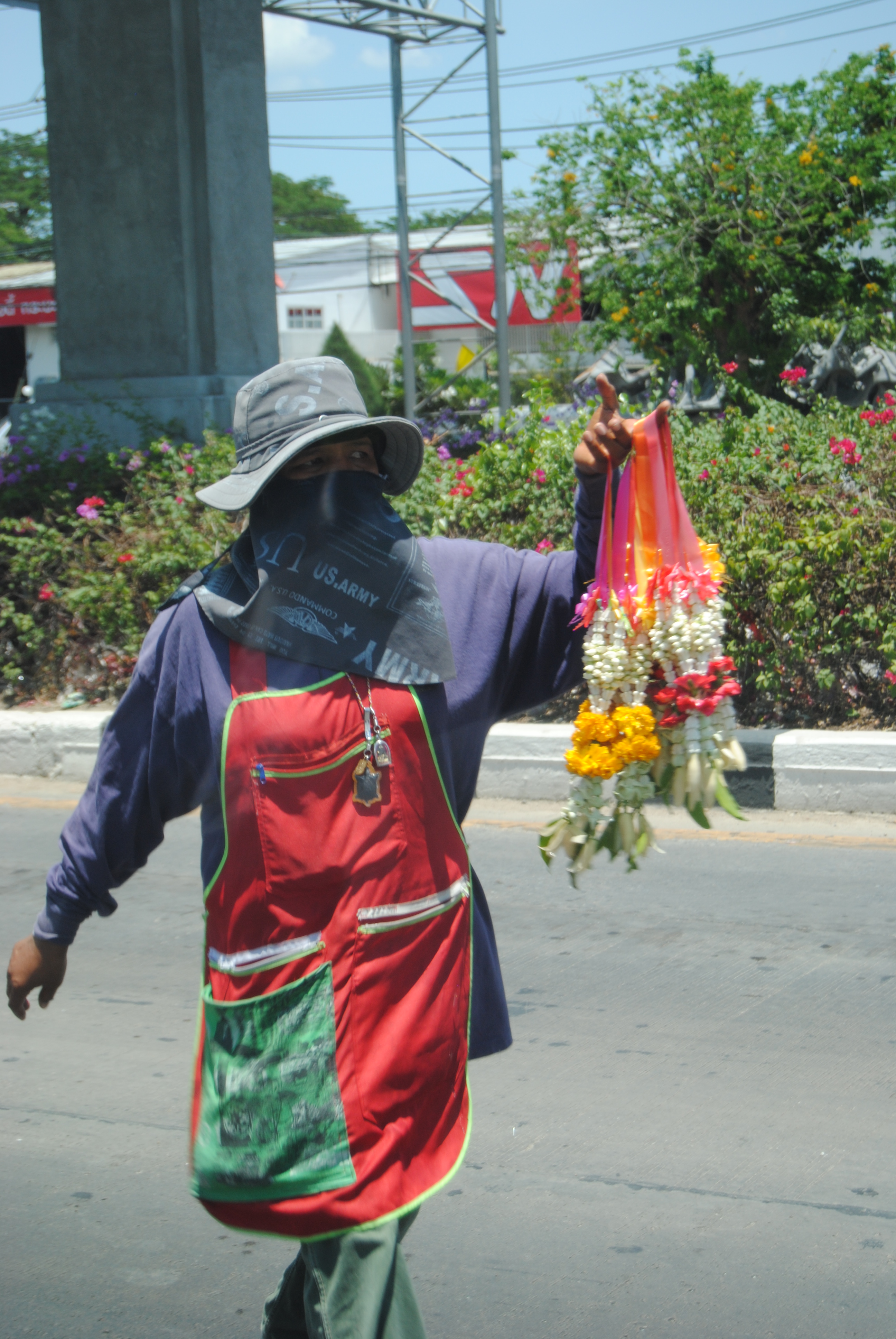 Woman Selling Flowers On The Street